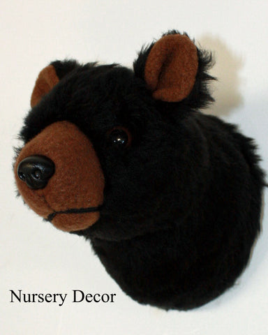 Tiny Plush black bear on a white background with text: 'Nursery Decor' 