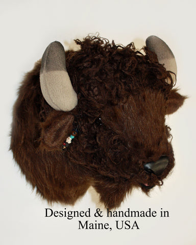 Small plush bison head  on a white background, labeled 'Designed & handmade in Maine, USA'.