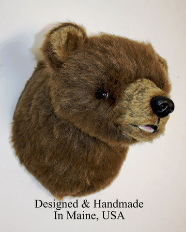 Plush bear head with 'Designed & Handmade In Maine, USA' text on a white background